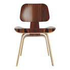 The santos palisander Eames Molded Plywood Dining Chair Wood Base from Herman Miller.
