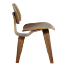 The walnut Eames Molded Plywood Dining Chair Wood Base from Herman Miller from the side.