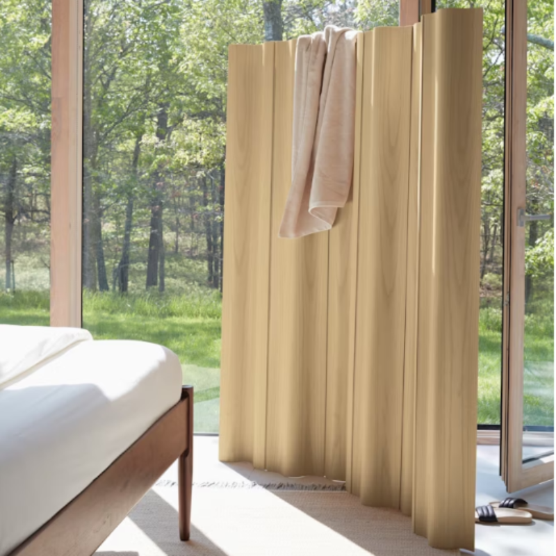 The Eames Molded Plywood Folding Screen from Herman Miller in a bedroom.