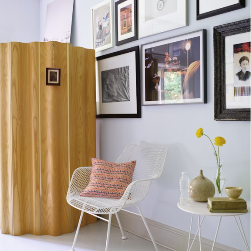 The Eames Molded Plywood Folding Screen from Herman Miller in a lounge.