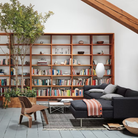 The Santos Palisander Eames Molded Plywood Lounge Chair Wood Base from Herman Miller in a living space.