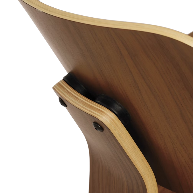 The Walnut Eames Molded Plywood Lounge Chair Wood Base from Herman Miller close up.