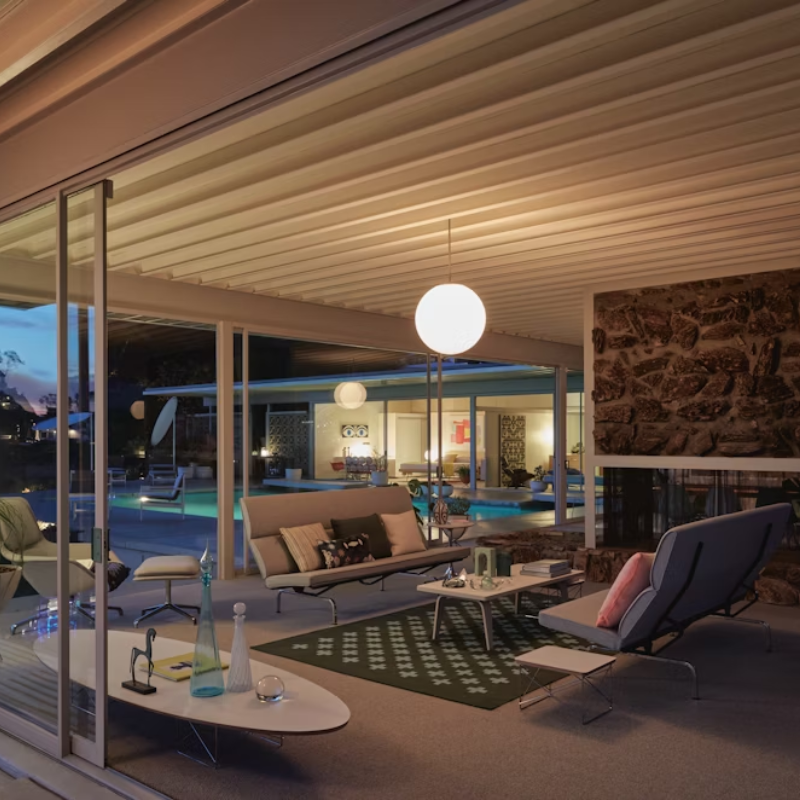 The studio white and ash laminate Eames Rectangular Coffee Table within a living space.