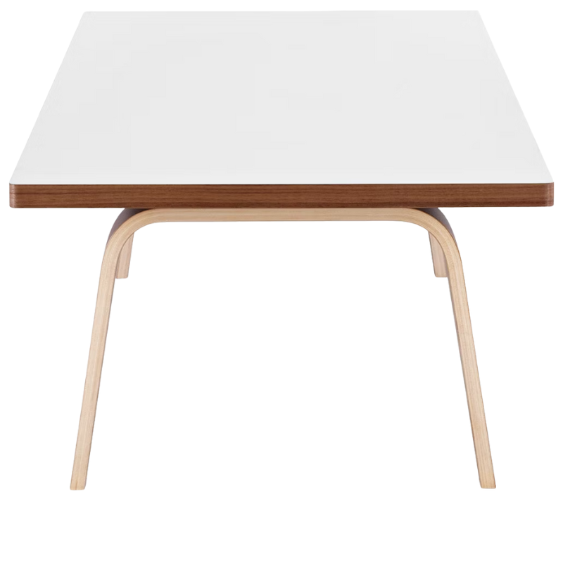 The 22 by 48 inch white and walnut laminate Eames Rectangular Coffee Table from the side.