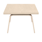 The 22 by 36 inch studio white ash veneer Eames Rectangular Coffee Table from the side.