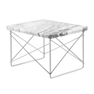 The Eames Wire Base Low Table from Herman Miller with the Georgia grey marble top and chrome base in a studio lifestyle photograph from an angle.