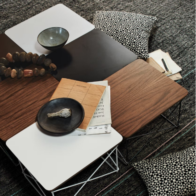 The Eames Wire Base Low Table from Herman Miller in a lounge lifestyle photograph.