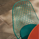 The Eames Wire Chair from Herman Miller, designed by Herman Miller x HAY with a seat pad close up.