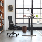 The Embody Chair from Herman Miller with black sync fabric in a commercial office. all-groups
