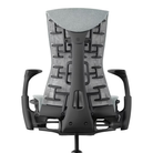 The Embody Chair from Herman Miller with dark mineral sync fabric and a graphite black frame from the back.