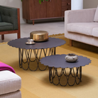 The anthracite Girard Flower Table from Herman Miller in a family space. all-groups