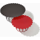 The large anthracite and small vivid red Girard Flower Table from Herman Miller in a studio. all-groups
