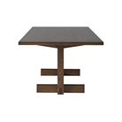 The 75 inch umber on oak Land Dining Table from Herman Miller from the side.