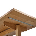 The 75 inch white oak Land Dining Table from Herman Miller showing the underside of the table.