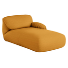 The right Luva Modular Chaise from Herman Miller in Mustard Seed Whim upholstery.