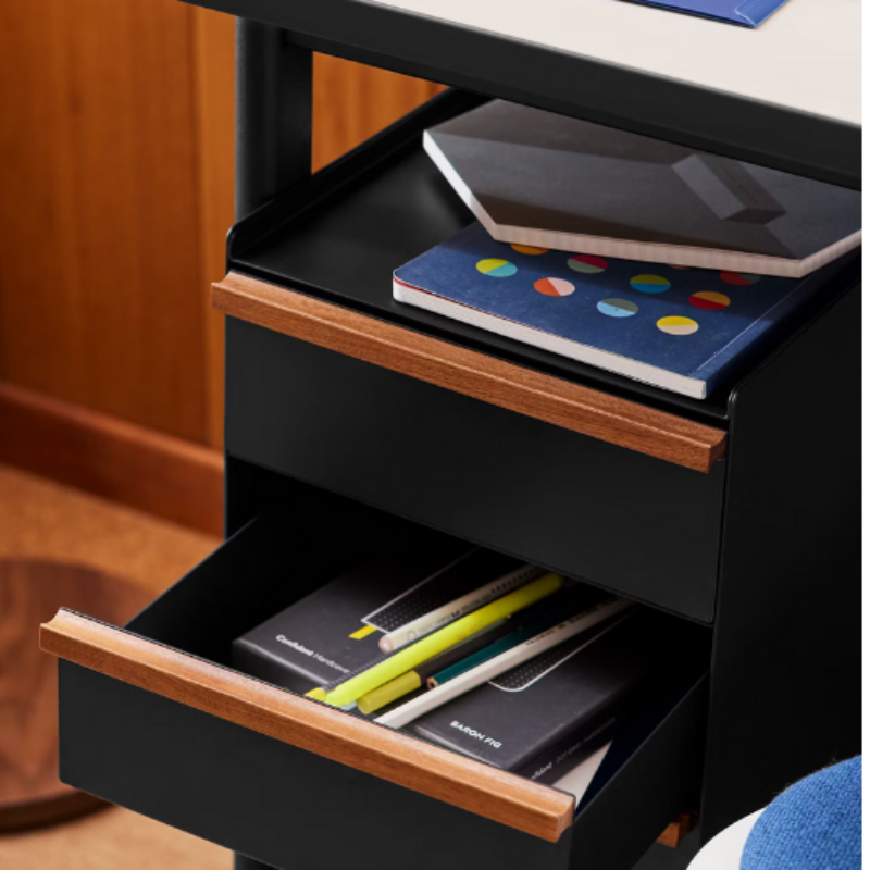 The Mode Desk from Herman Miller being used as storage with the photograph focusing on the drawers.