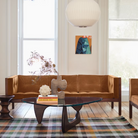 The Nelson Angled Sphere Bubble Pendant from Herman Miller in a living room lifestyle photograph within a home.