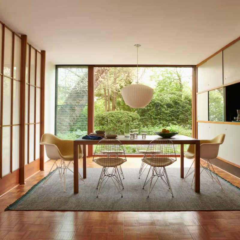 The Nelson Apple Bubble Pendant from Herman Miller illuminating a dining room