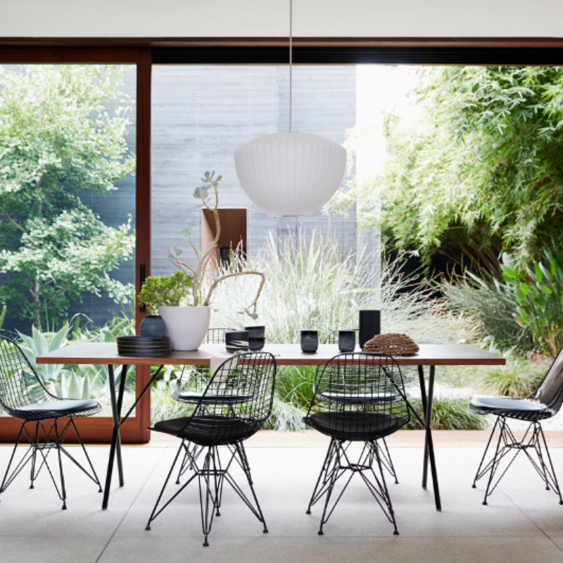 The Nelson Apple Bubble Pendant from Herman Miller illuminating a dining room.