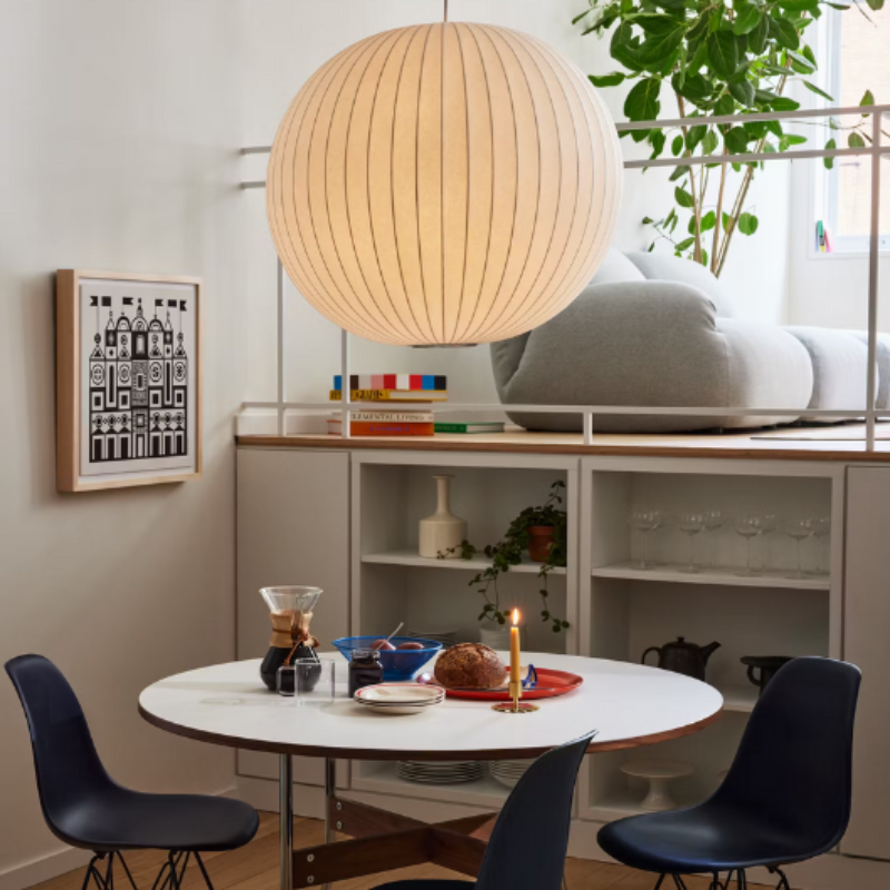 The Nelson Ball Bubble Pendant from Herman Miller suspended above a dining table.