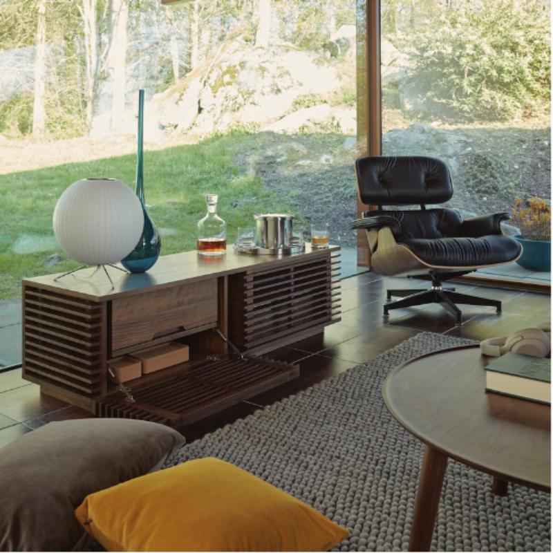 The Nelson Ball Tripod Table Lamp from Herman Miller in a living room lifestyle photograph.