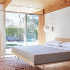 The Nelson Ball Wall Sconce from Herman Miller in a bedroom.