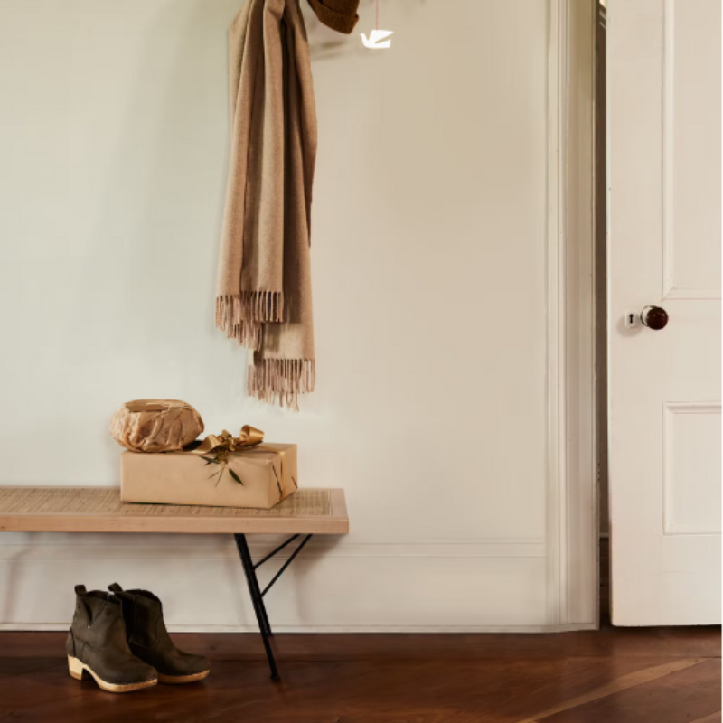 The Nelson Cane Bench from Herman Miller in an entryway.