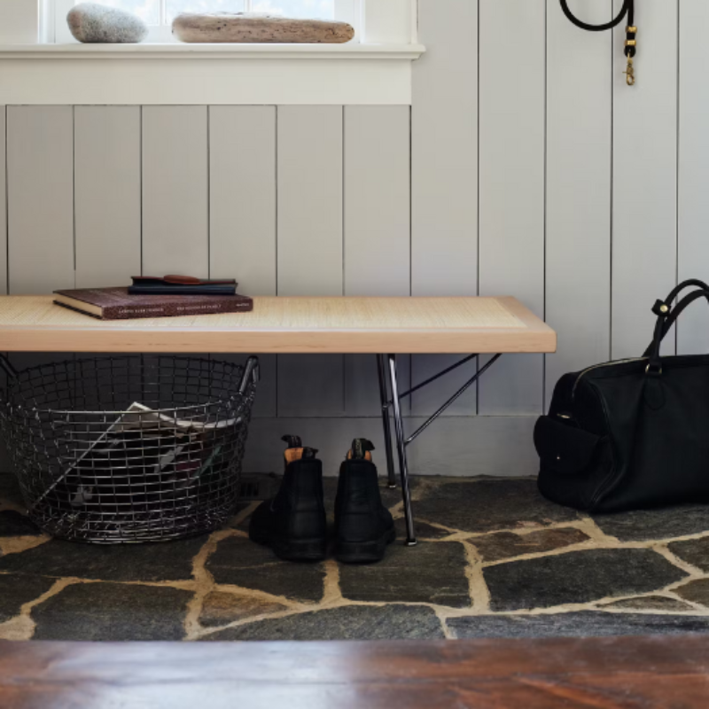 The Nelson Cane Bench from Herman Miller within a family space.
