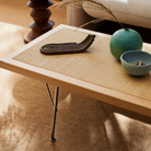 The Nelson Cane Bench from Herman Miller in a living room.