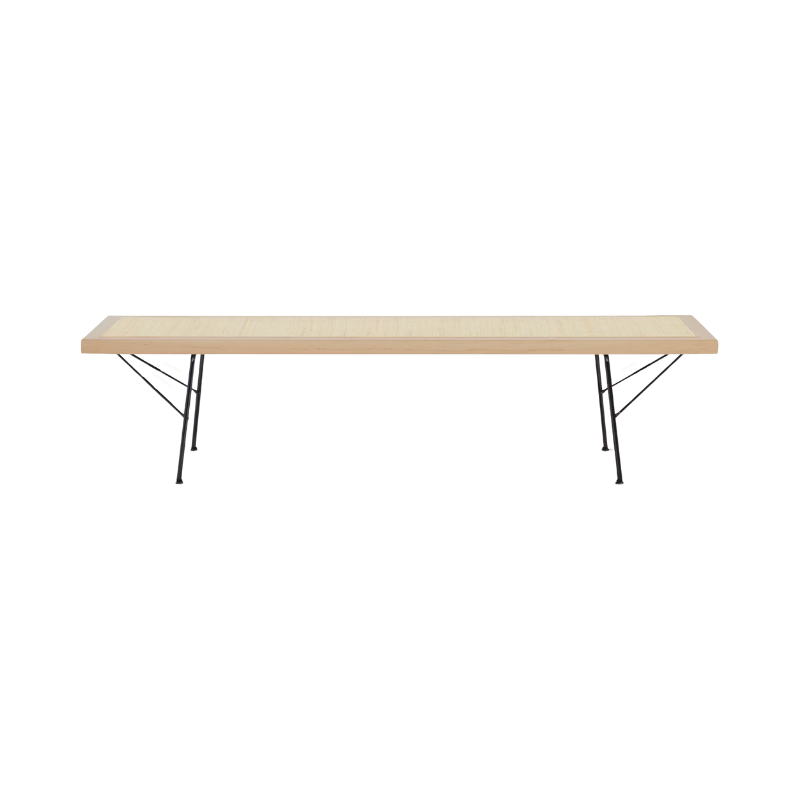 The Nelson Cane Bench from Herman Miller in maple 60 inch with black legs.