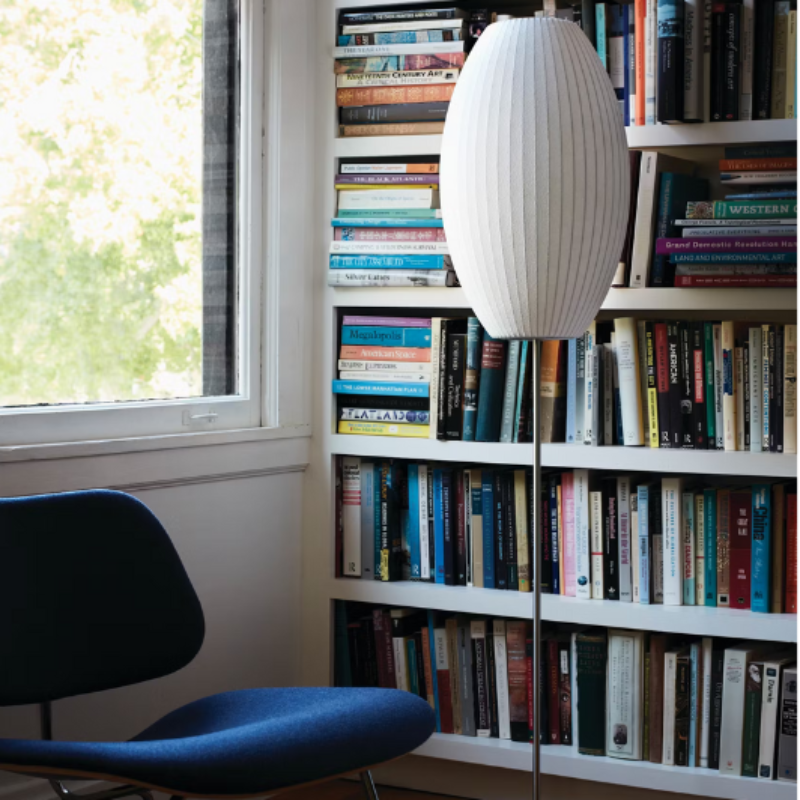 The large walnut Nelson Cigar Lotus Floor Light from Herman Miller is in the study room. 