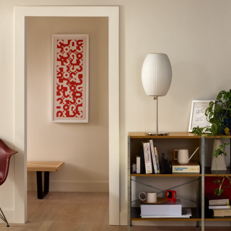 The Nelson Cigar Lotus Table Lamp from Herman Miller in a living room lifestyle photograph.