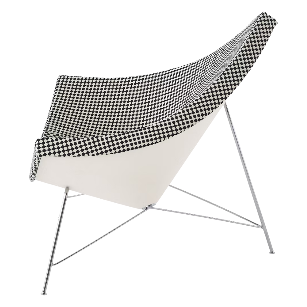 The Nelson Coconut Chair from Herman Miller with the black and white checker upholstery and chrome base from the side.