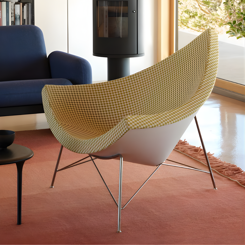 The Nelson Coconut Chair from Herman Miller with the light emerald and ivory checker upholstery and chrome base in a living room.