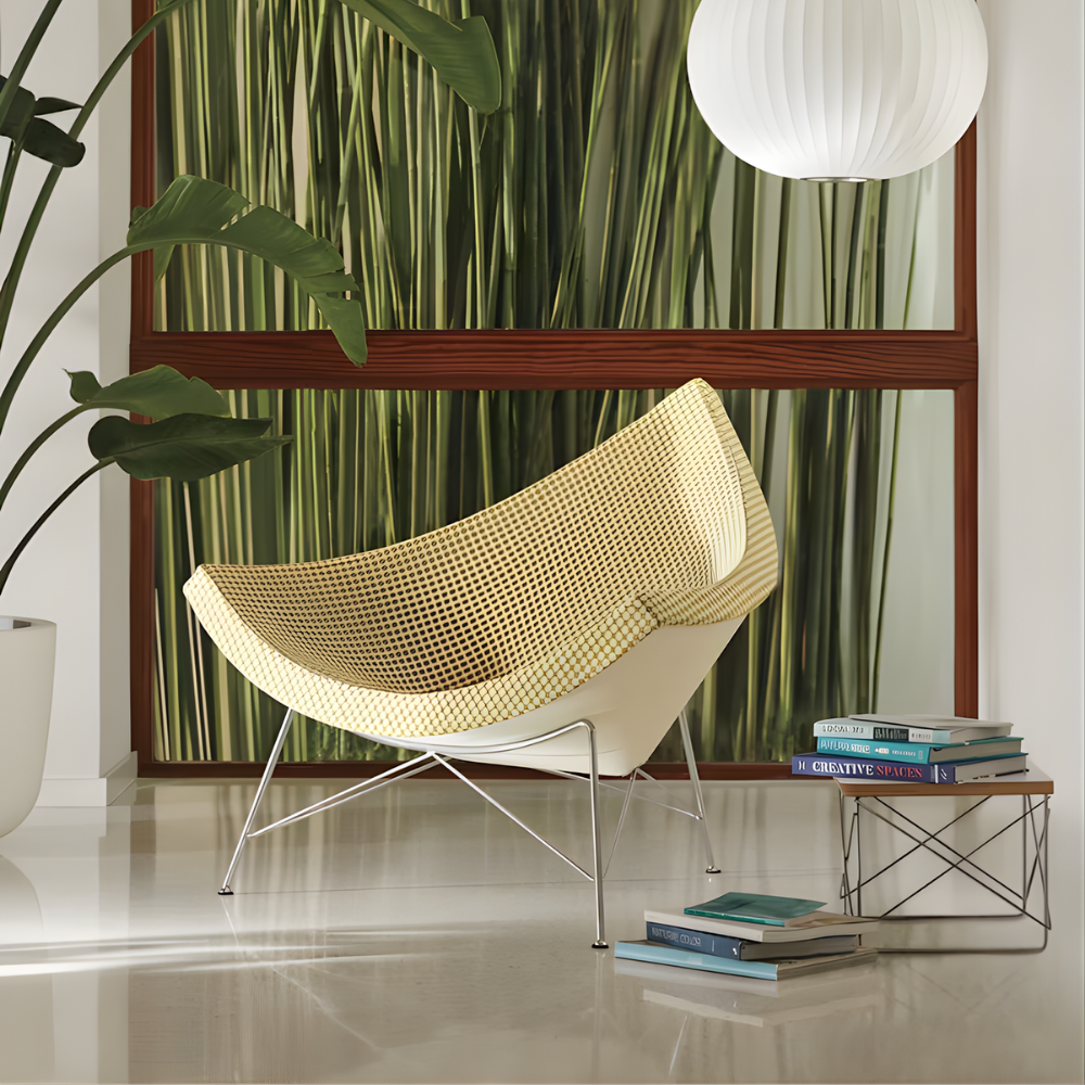 The Nelson Coconut Chair from Herman Miller with the light emerald and ivory checker upholstery and chrome base in a lounge space.