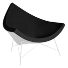 The Nelson Coconut Chair from Herman Miller with the obsidian prone leather upholstery and white base.