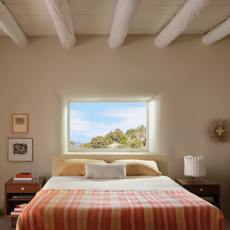 The Nelson Lantern Tripod Table Lamp from Herman Miller in the bedroom.