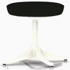 The Nelson Pedestal Stool from Herman Miller with black hopsak upholstery and a white base.