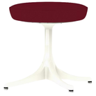 The Nelson Pedestal Stool from Herman Miller with dark crimson hopsak upholstery and a white base.