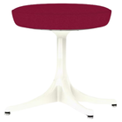 The Nelson Pedestal Stool from Herman Miller with dark pink hopsak upholstery and a white base.