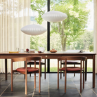 The Nelson Saucer Bubble Pendant from Herman Miller suspended above a dining table.