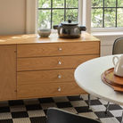 The Nelson Thin Edge Buffet from Herman Miller in white oak in a dining room.