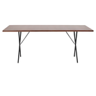 The walnut and black Nelson X-Leg Table from Herman Miller showing the long side.