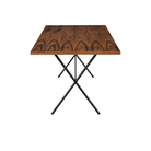 The walnut and black Nelson X-Leg Table from Herman Miller from the side.