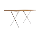 The 30 by 60 inch walnut and chrome Nelson X-Leg Table from Herman Miller from an angle.