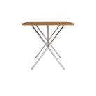 The 30 by 60 inch walnut and chrome Nelson X-Leg Table from Herman Miller from the side.