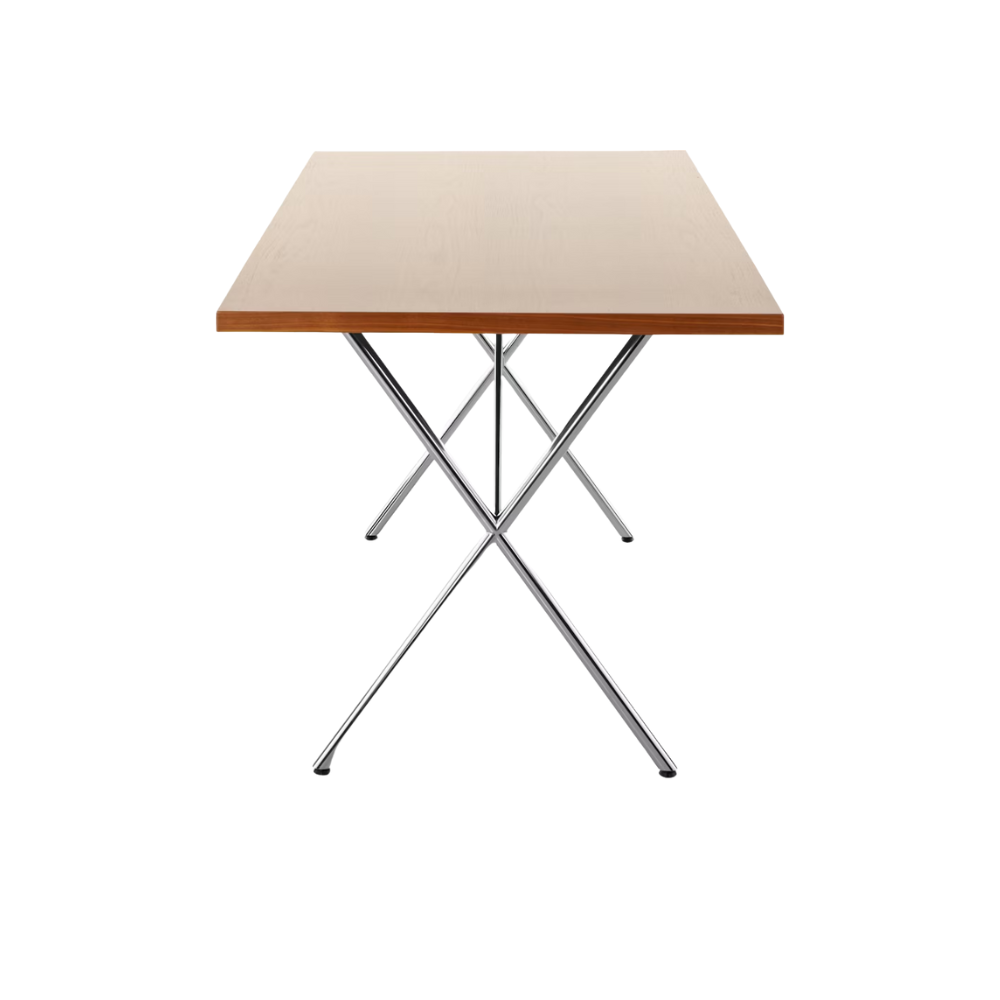 The 36 by 72 inch walnut and chrome Nelson X-Leg Table from Herman Miller from the side.