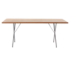 The 36 by 72 inch walnut and chrome Nelson X-Leg Table from Herman Miller.