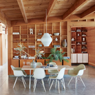 The white Nelson X-Leg Table from Herman Miller in a dining area.