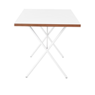 The 30 by 60 inch white Nelson X-Leg Table from Herman Miller from the side.